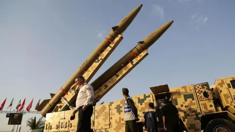 Anadolu via Getty Images Missile launchers in a square in Iran. 
