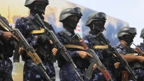 EPA Houthi troops stand guard during a protest against Saudi Arabia, in Sanaa, Yemen (17 July 2026)