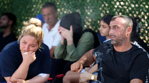 Reuters Ayten Bicer and Hayri Bicer, whose two children are missing after a passenger boat capsized off the coast of Kyrenia,