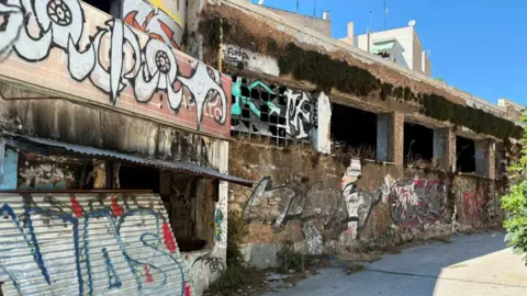 Reuters An abandoned building with missing windows is covered in graffiti