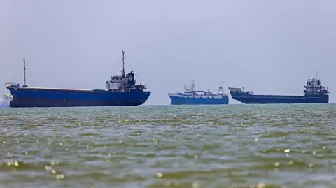 AFP via Getty Images Three vessels anchored in Bandar Abbas along the Strait of Hormuz