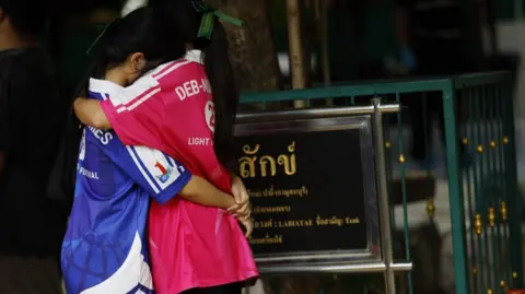 EPA Students embrace each other following a school shooting at Debsirin Nonthaburi School
