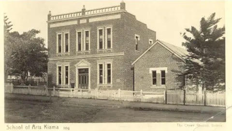 Kiama Library A sepia photo of a late 19th century house-like brick building