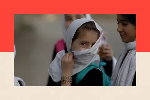 A girl hides her face behind a white hijab