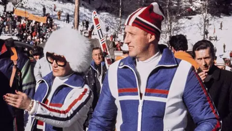 AFP via Getty Images Prince Harald of Norway (R) and princess Sonja of Norway (L) attend the 1976 Winter Olympics, on February 8, 1976 in Seefeld.