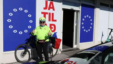 Reuters A man poses outside the "Yes to See" movement's office ahead of a referendum on whether Iceland should resume accession negotiations with the European Union, in Reykjavik, Iceland, August 2