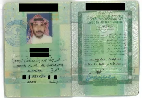 SDNY Omar al-Bayoumi's passport shows him in a Saudi red-and-white headscarf called a shemagh.