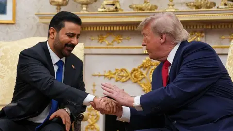 Getty Images Al-Zaidi and Trump shake hands in the Oval Office