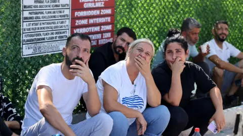 Reuters People wait for news of their relatives at Kyrenia port.