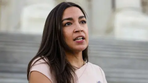 Reuters U.S. Representative Alexandria Ocasio-Cortez (D-NY) speaks to reporters.