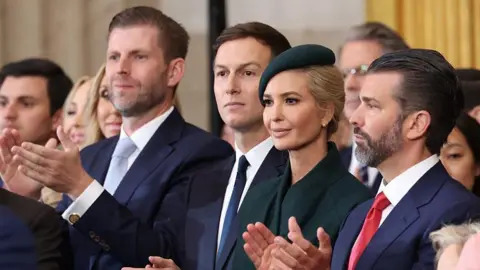 AFP via Getty Images From L to R, Eric Trump, Jared Kushner, Ivanka Trump and Donald Trump, Jr. applaud during the inauguration of Donald Trump as the 47th president of the United States in the Rotunda of the US Capitol in Washington, DC, on January 20, 2025. 
