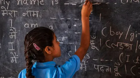 Getty Images Indian schoolgirl in classroom, English language class, Rajasthan, India, 2018