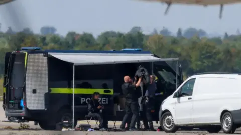 Reuters police work at the scene