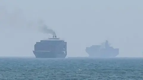 Getty Images Cargo ships anchoring near the Strait of Hormuz off the eastern coast of the United Arab Emirates at Khor Fakkan on 12 July.