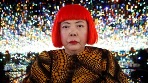 Reuters Japanese artist Yayoi Kusama poses for a photograph inside her Infinity Mirrored Room installation titled "The Souls of Millions of Light Years Away" during a media preview of her new exhibition at the David Zwirner gallery in New York, U.S.