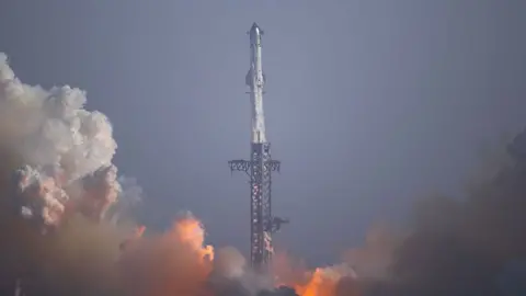 NurPhoto via Getty Images Starship 40 and Booster 20 launch from SpaceX's facility in Cameron County, Texas, on 24 July, 2026, for what the company called ''Flight 13.''