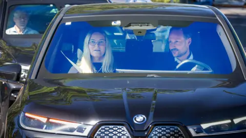 EPA Crown Prince Haakon of Norway (R) and Crown Princess Mette-Marit of Norway sit in a car as they arrive at the Oslo University Hospital