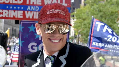 Getty Images Milo Yiannopoulos is seen at the Boston Straight Pride Parade in 2019. He wears a Make America Straight Again hat.