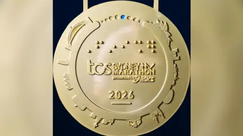 Instagram: sydney_marathon A photo showing the Sydney Marathon medal, as shared by organisers on social media.