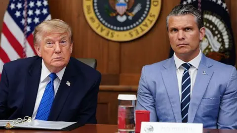 AFP via Getty Images US President Donald Trump and Secretary of Defense Pete Hegseth listen to questions from the press during a Cabinet meeting.