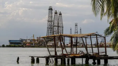 AFP via Getty Images Oil rigs are pictured in Cabimas, south of Lake Maracaibo, Zulia State, Venezuela, on January 31, 2026. 
