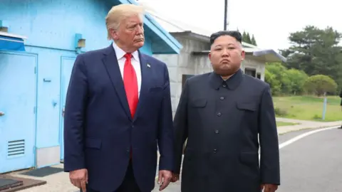 Getty Images North Korean leader Kim Jong Un and US President Donald Trump inside the demilitarized zone (DMZ) separating the South and North Korea on 30 June 2019