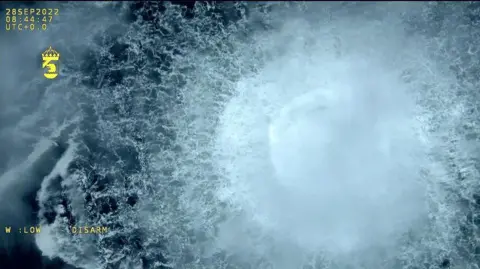 Swedish Coast Guard A screen grab from Danish Defense shows a gas leak causes bubbles on the surface of the water at Sea in Sweden on September 30, 2022