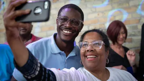 Getty Images David Crowley poses for a selfie alongside a supporter while campaigning to be the Democratic candidate for Wisconsin governor