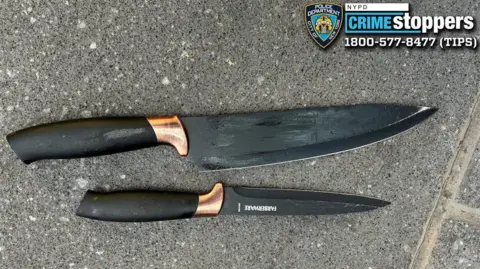 NYPD Two black knives. One is larger than the other.