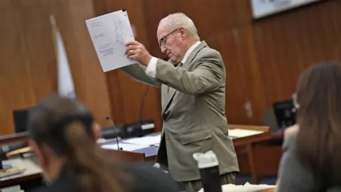 Reuters Kevin Reddington holds up papers in court in Plymouth, Massachusetts on 25 August