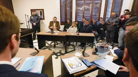 Getty Images Argentine Patricia Kadgien, daughter of Friedrich Kadgien, one of several high-ranking Nazis to escape to Argentina after the war, and her husband Juan Carlos Cortegoso attend a court hearing in Mar del Plata, near Buenos Aires, Argentina, on 4 September