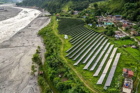 Getty Images The Nuwakot solar power plant by the flood-hit Trishuli River after catastrophic flooding