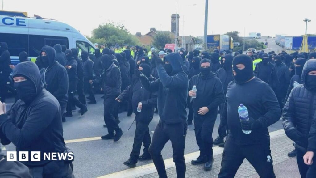 LIVEDisruption at Port of Dover as masked 'stop the boats' protesters block roadsHundreds of demonstrators, wearing black with their faces covered, caused delays to traffic reaching the port.