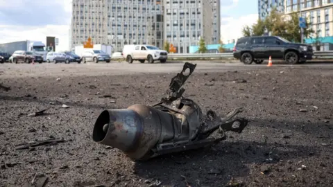 Reuters The engine from a Russian jet-powered drone lying in a street after a Russian attack. 