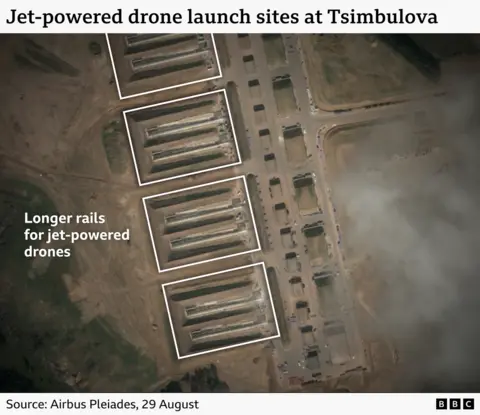 A satellite image showing new longer rails for jet-powered drones at Tsymbulova base. 