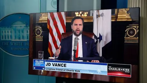 Getty Images A video feed is displayed in the White House Briefing Room as U.S. Vice President JD Vance hosts a podcast episode of 'The Charlie Kirk Show' following the assassination of the show's namesake, at the White House on September 15, 2025 in Washington, DC.