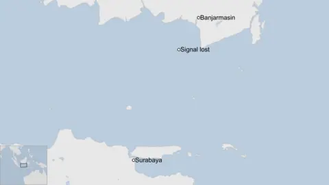 A map showing part of Indonesia. The city of Surabaya is shown in the south west and Banjarmasin is shown to the north. A circle with the text "signal lost" is south of Banjarmasin.