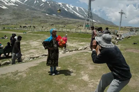 Corbis via Getty Images 
Digital world in the Himalayas
Lay and sometimes illiterate photographers making a living in the Himalayas by taking photos of tourists (Photo by Pallava Bagla/Corbis via Getty Images)