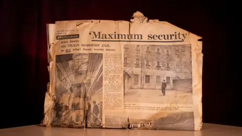 PA Media Pages from the Daily Express newspaper in 1966 detailing the "maximum security" prison where the Great Train Robbers were incarcerated