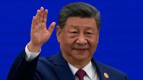 Getty Images Chinese President Xi Jinping waves as he arrives at the opening ceremony for the World AI Conference on July 17, 2026 in Shanghai, China.