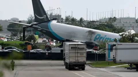 Getty Images The plane sitting at a crooked angle to the ground