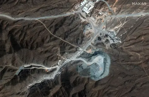 Vantor via Getty Images A Vantor satellite image shows tunnel construction activity and road infrastructure near the Natanz nuclear facility in the area around Pickaxe Mountain in Iran. Photo: September 2025.
