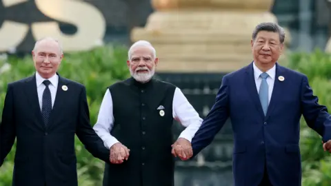 Reuters Russia's President Vladimir Putin, India's Prime Minister Narendra Modi and China's President Xi Jinping pose for a family photo during the BRICS summit in New Delhi, India, September 12, 2026