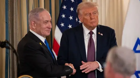 Getty Images Trump and Netanyahu shaking hands in July at the White House