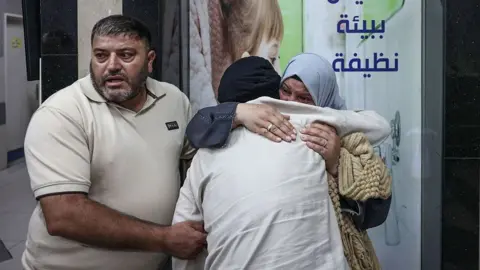 AFP via Getty Images Relatives mourn two Palestinians who were killed in al-Mughayyir during an attack by Israeli settlers and soldiers, at a hospital in Ramallah, in the occupied West Bank (2 September 2026)