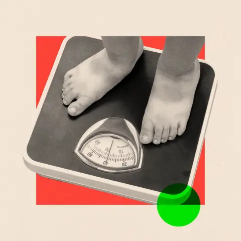 Getty Images A treated black-and-white image of a pair of legs on some scales