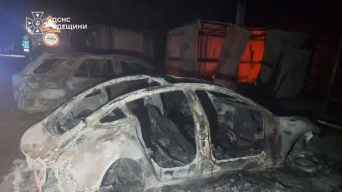 Reuters Burned out cars appear at the site of a Russian drone strike on the Starokozache border crossing between Ukraine and Moldova. Photo: 9 September 2026.