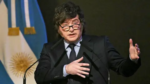 Getty Images Argentina's President Javier Milei delivers a speech